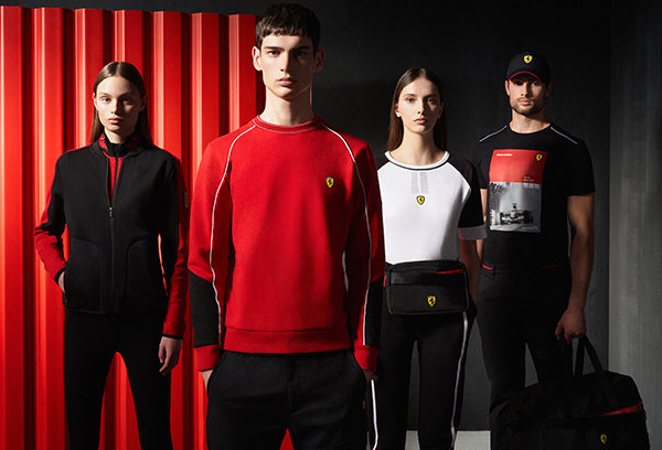 Four models, two men and two women, wear Scuderia Ferrari's clothes and accessories.