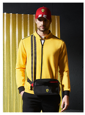 Two half-body models, a man and a woman, wear Scuderia Ferrari's clothes and accessories.