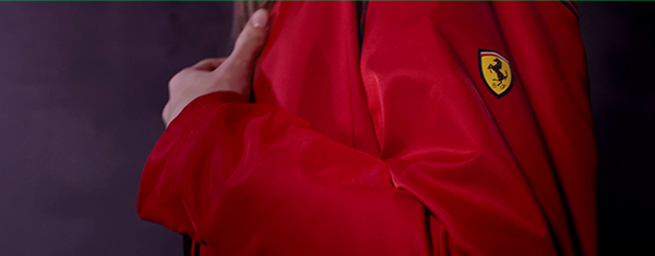CLOSE UP ON THE RED SOFTSHELL JACKET WITH FIT SYSTEM