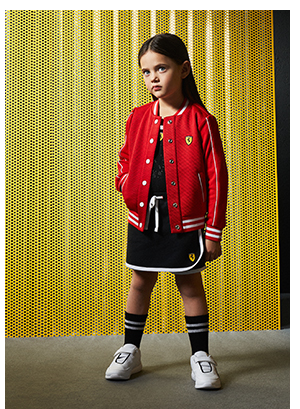 A girl wearing Scuderia Ferrari Collection's clothes and accessories