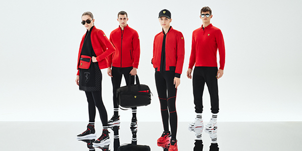 A group of models wearing Scuderia Ferrari clothes and accessories