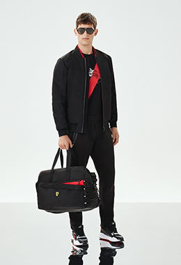 Whole-body man wearing black and red clothes and accessories.