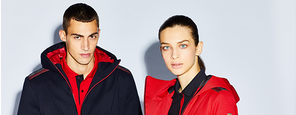 A HALF-BODY WOMAN AND A MAN WEARING RED AND BLACK ITA FLAG CLOTHES