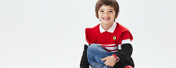 Half-body boy wearing Scuderia Ferrari clothes and accessories
