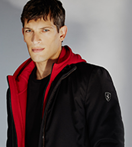 Close-up of a man wearing Scuderia Ferrari Collection clothes.