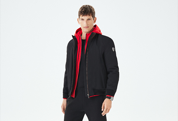 Half-body man wearing Scuderia Ferrari Collection clothes.