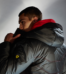 RED JACKET IN RECYCLED NYLON AND SOFTSHELL WITH GRAPHENE SOFT FILLING AND A MAN SEEN FROM BEHIND WEARING THE GREY VERSION