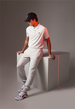 HALF-LENGTH PICTURE OF A MAN WEARING SCUDERIA FERRARI CLOTHES AND ACCESSORIES