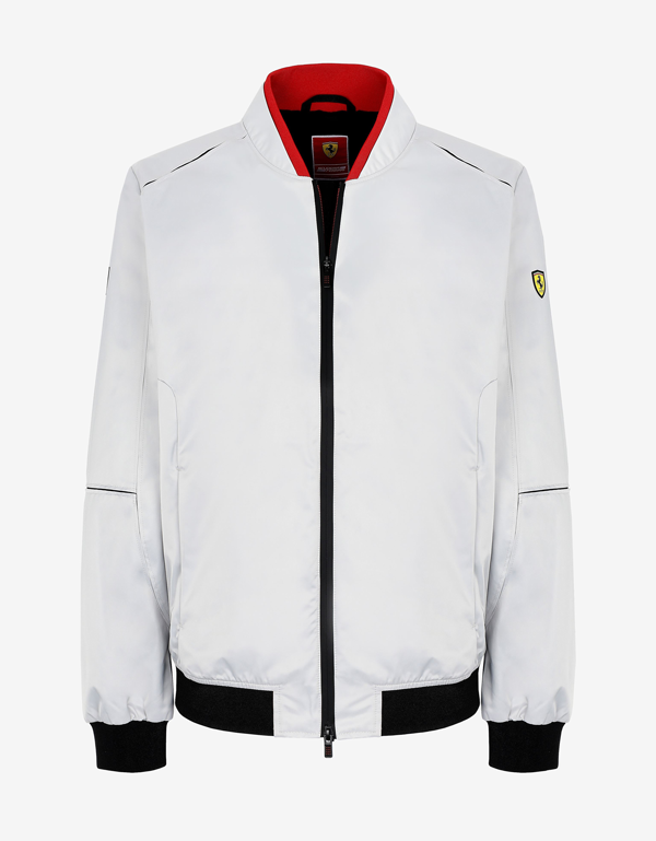 GREY BOMBER JACKET IN RECYCLED SATIN AND HALF-LENGTH PICTURE OF A MAN WEARING THE SAME ITEM.