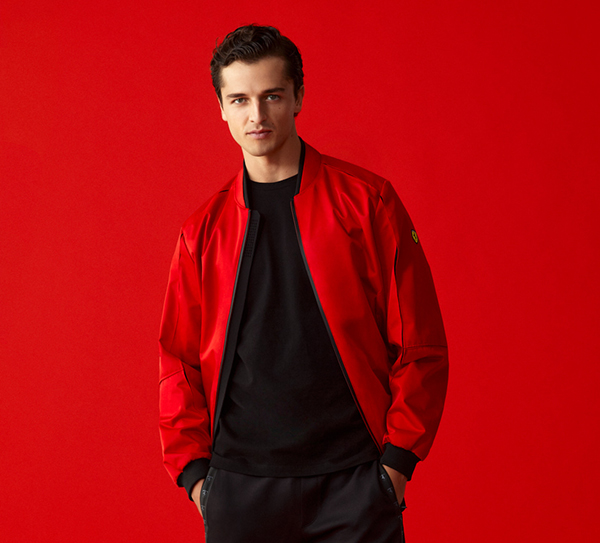 HALF-LENGTH PICTURE OF A MAN WEARING RED BOMBER JACKET IN RECYCLED SATIN.