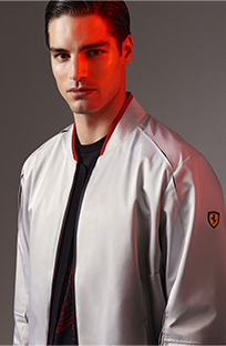 GREY BOMBER JACKET IN RECYCLED SATIN AND HALF-LENGTH PICTURE OF A MAN WEARING THE SAME ITEM.