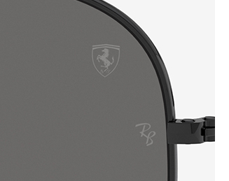 Picture of Ray-Ban for Scuderia Ferrari Outdoorsman and close-up picture of the Ferrari Shield and Ray-Ban logo on a dark grey lense.