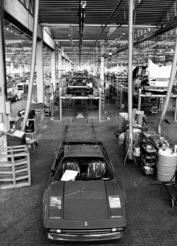Vintage black and white picture of the inside of Maranello Car Factory