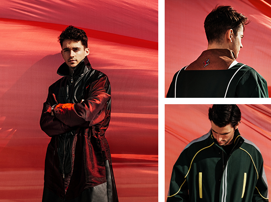Pictures of Charles Leclerc and a man wearing the new jackets in front of a red drape blown by the wind.