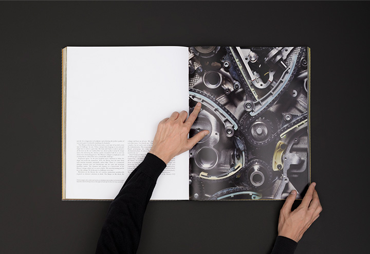 A picture of hands browsing Ferrari Monza Book