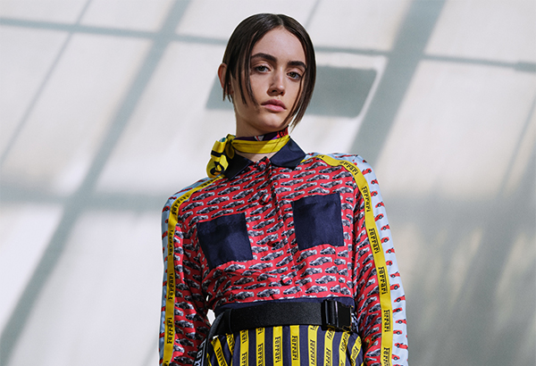 Half-length picture of a woman wearing all-over printed silk twill dress