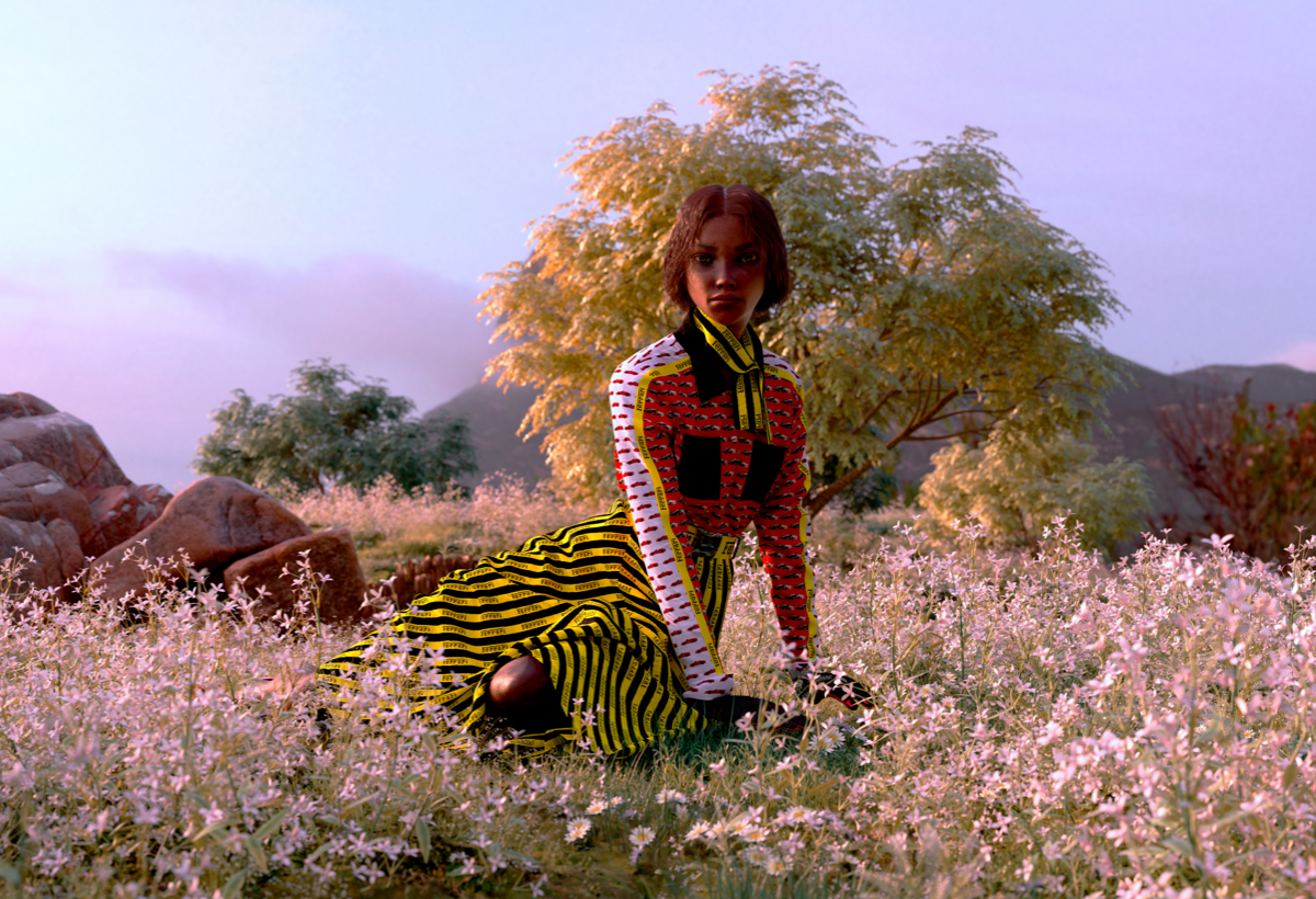 Full-length picture of a woman wearing Ferrari printed silk dress and accessories in a flowery meadow
