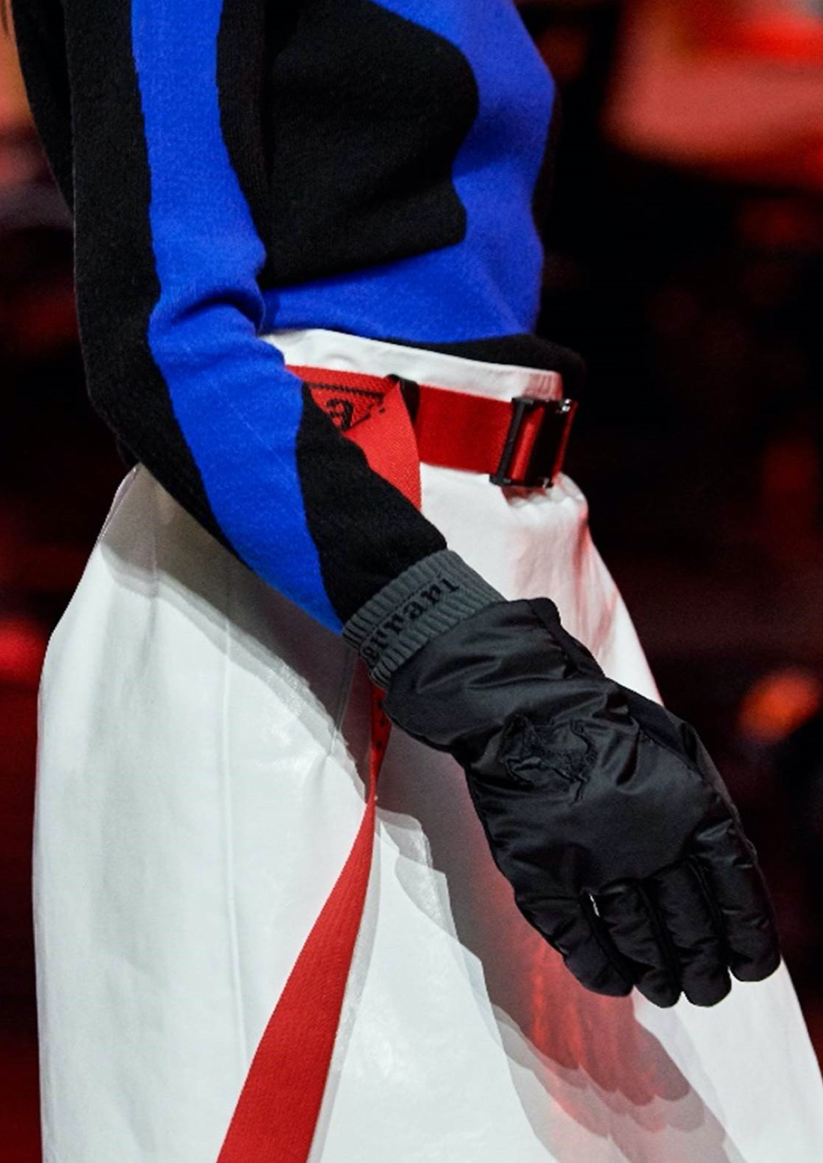 Close up of a model wearing a black pair of gloves