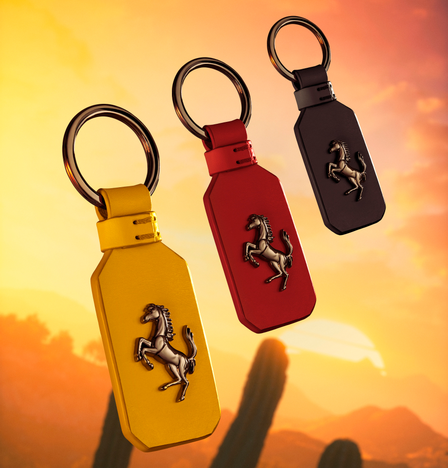 A set of three leather Prancing Horse keychains in the colors Terra bruciata, Yellow and Rosso Corsa