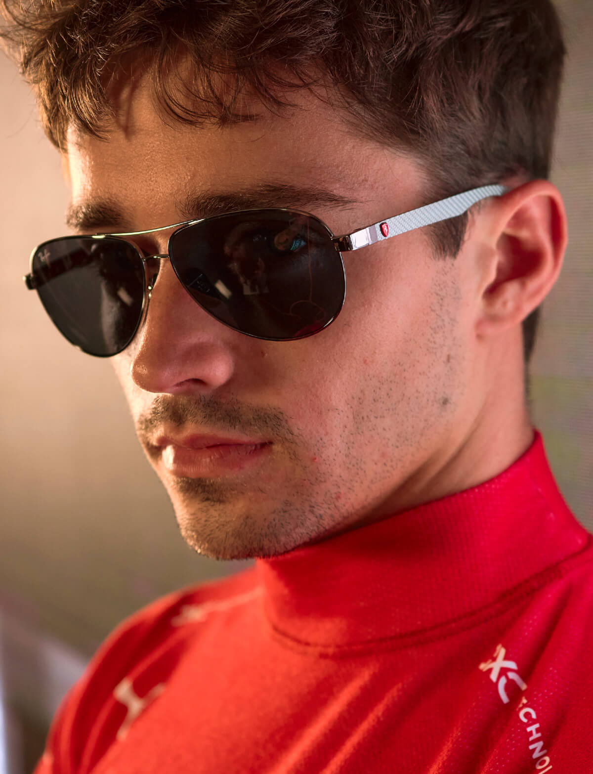 Aviator sunglasses in carbon fibre with red temples and Ferrari Shield detailing