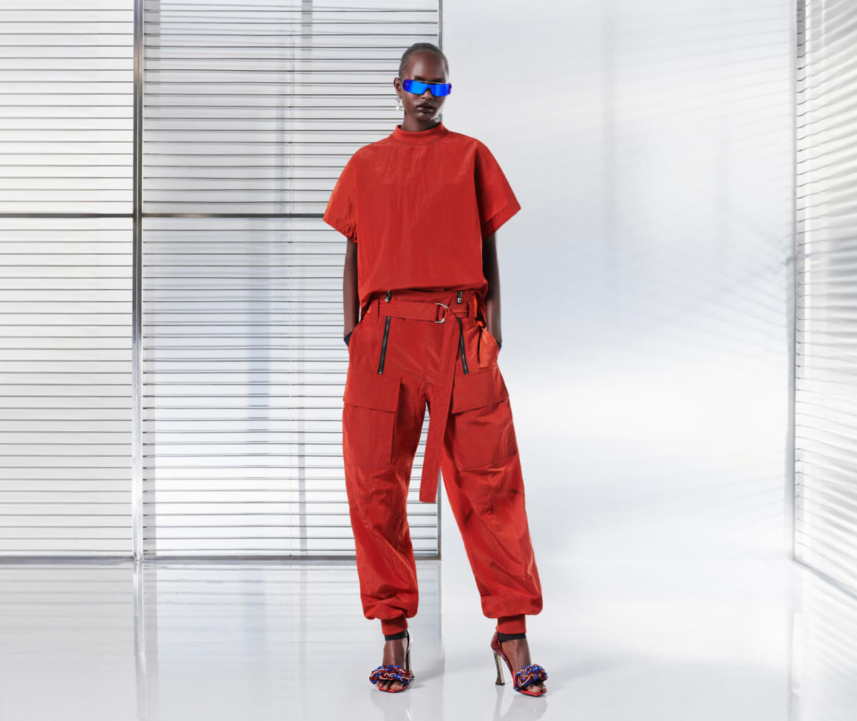Ferrari total look with fluid T-shirt, parachute trousers and woven sandals