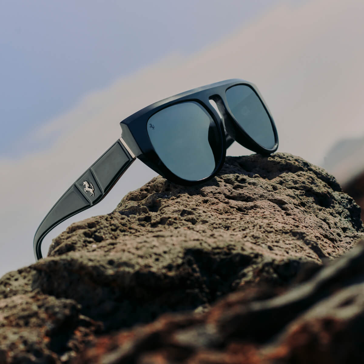 Black acetate Ferrari sunglasses with sculptural effects and polarised mirrored lenses