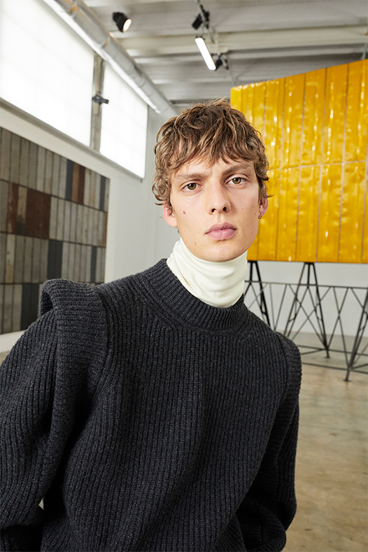 the model is wering the pacel sweater and smithy top from the men's fall winter 20 collection