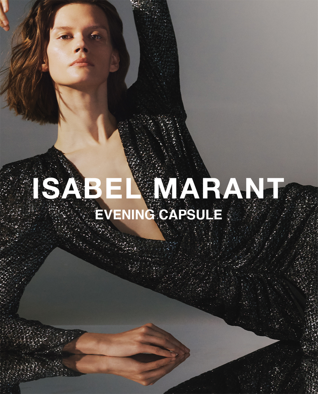 The model is wearing a black sequin dress from the Isabel Marant Evening Capsule