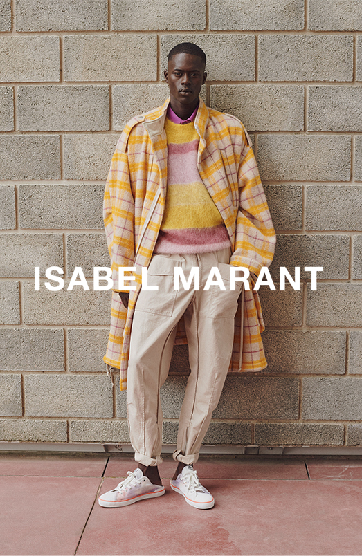 the model is wearing the Faduano coat, the Drussellh jumper, the Anafiko polo, the Tilsen pants and the Binkooh baskets from the Men's SS21 collection