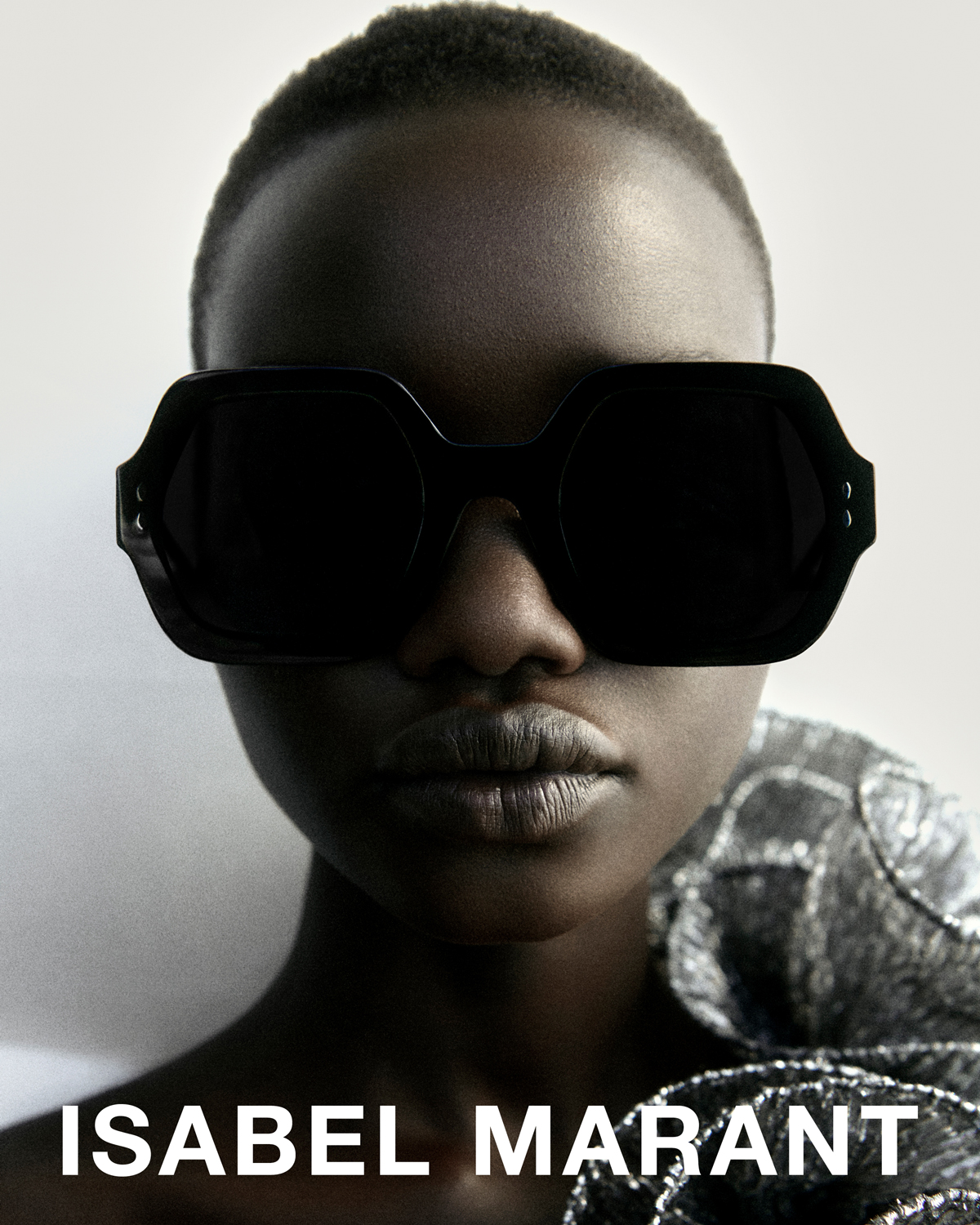 The model is wearing the Ely sunglasses and the Trudy top